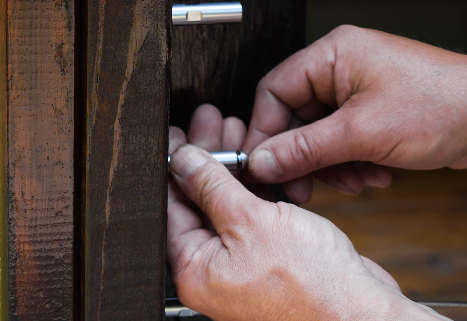 installing cable railing system into a wooden fence post